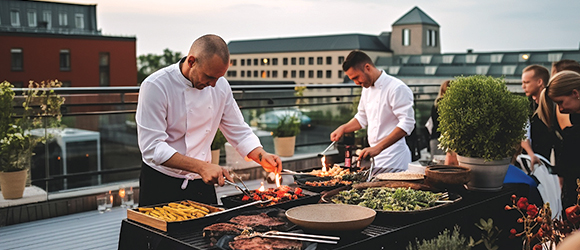 two chefs preparing food for a corporate event